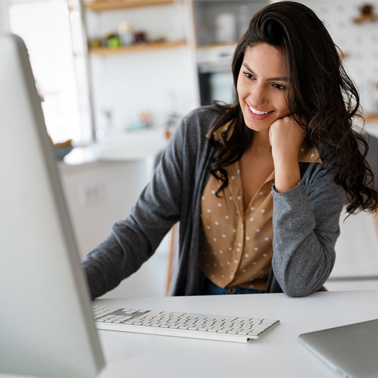 Business Woman Working at Her Desk on Computer